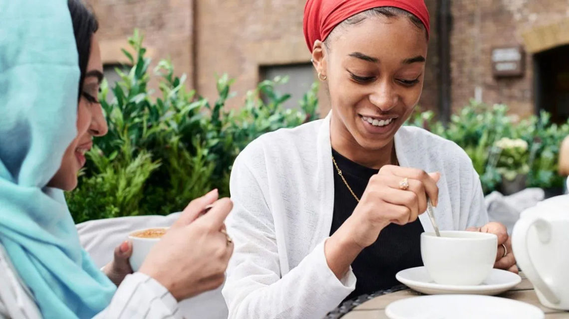 Diverse women drinking coffee